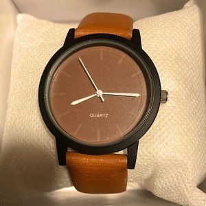 A brownish tan and black watch